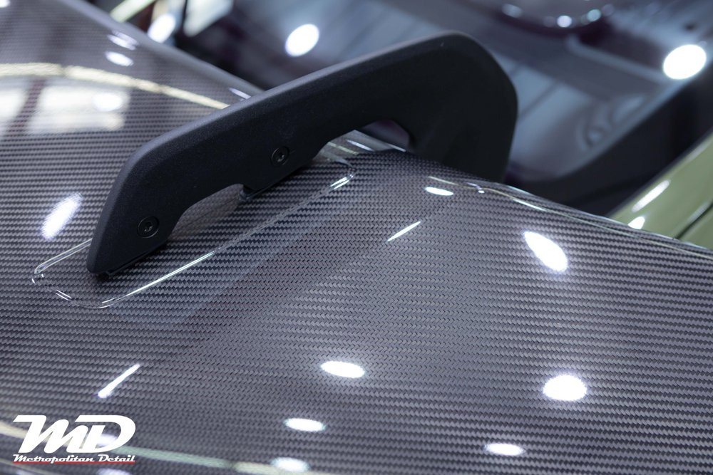 Carbon rear wing detail under DYNOshield